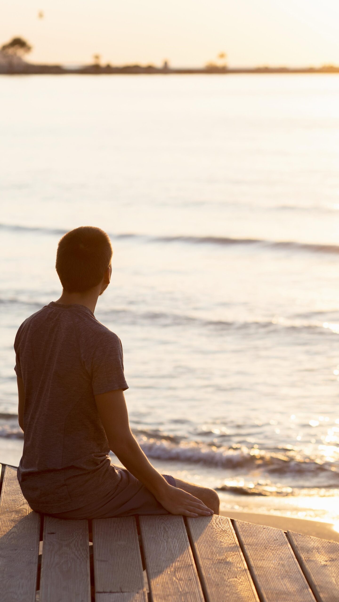 man-meditating-beach